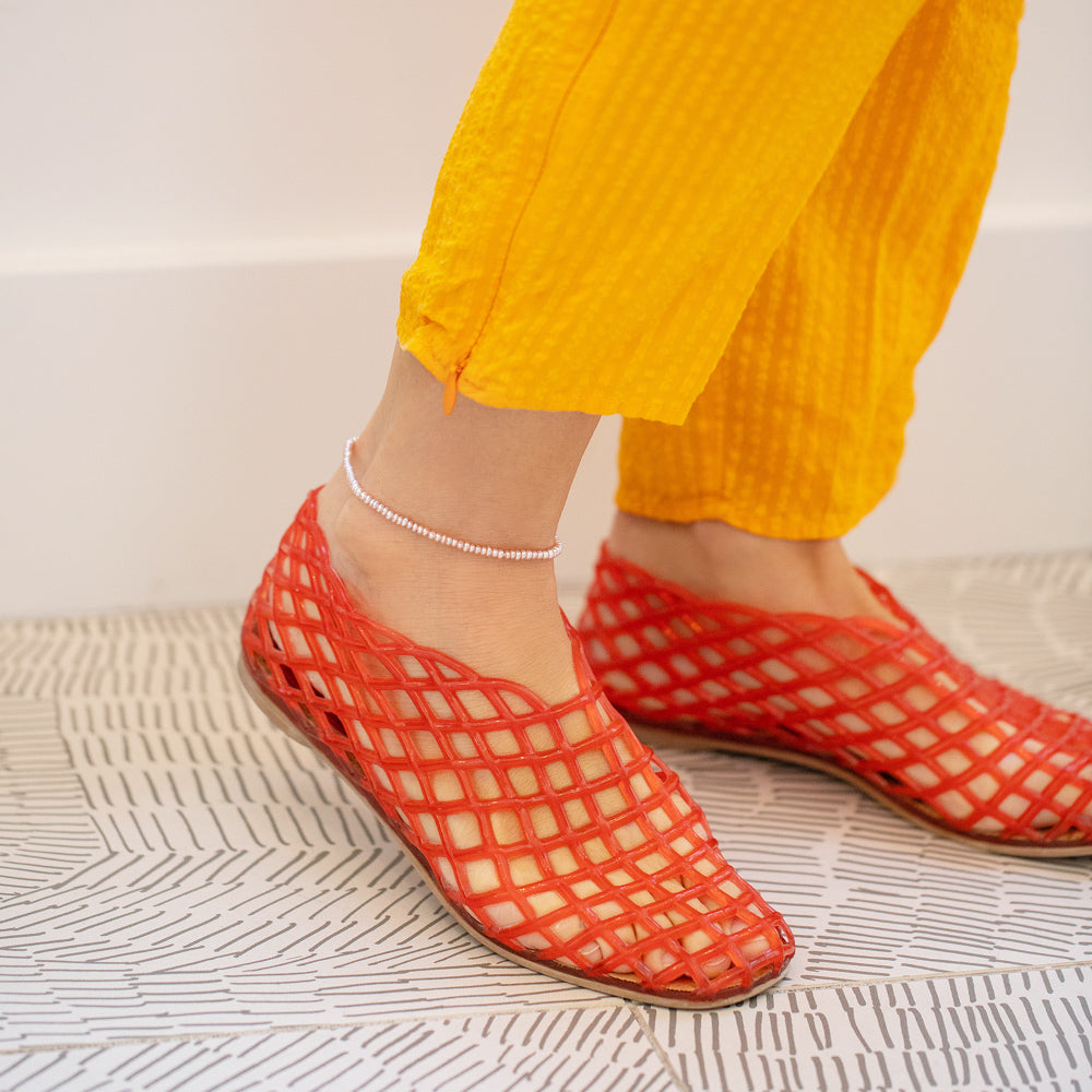 product_details::Pink Pebble Seed Pearl Anklet on model.