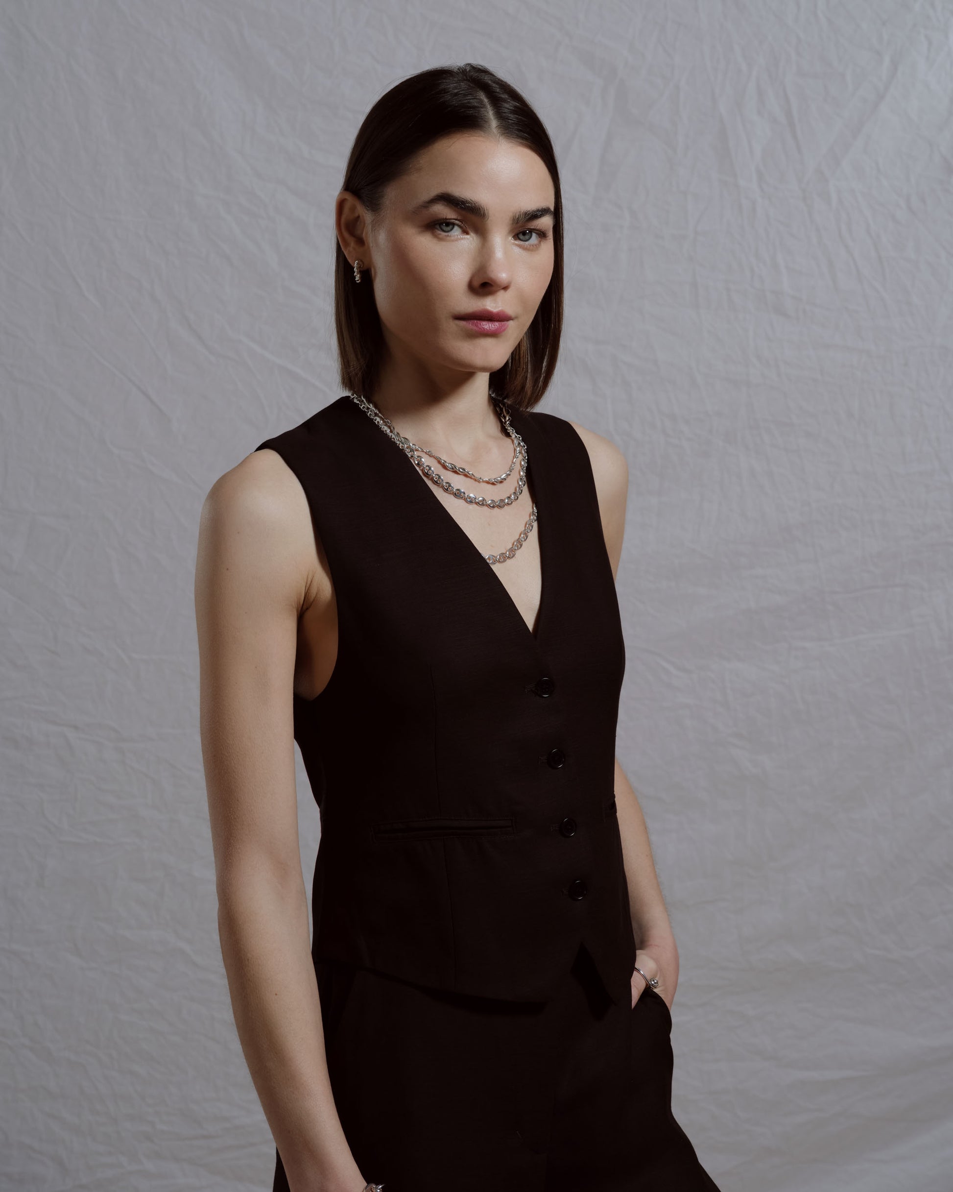 Styled image featuring CRZM jewelry on model.