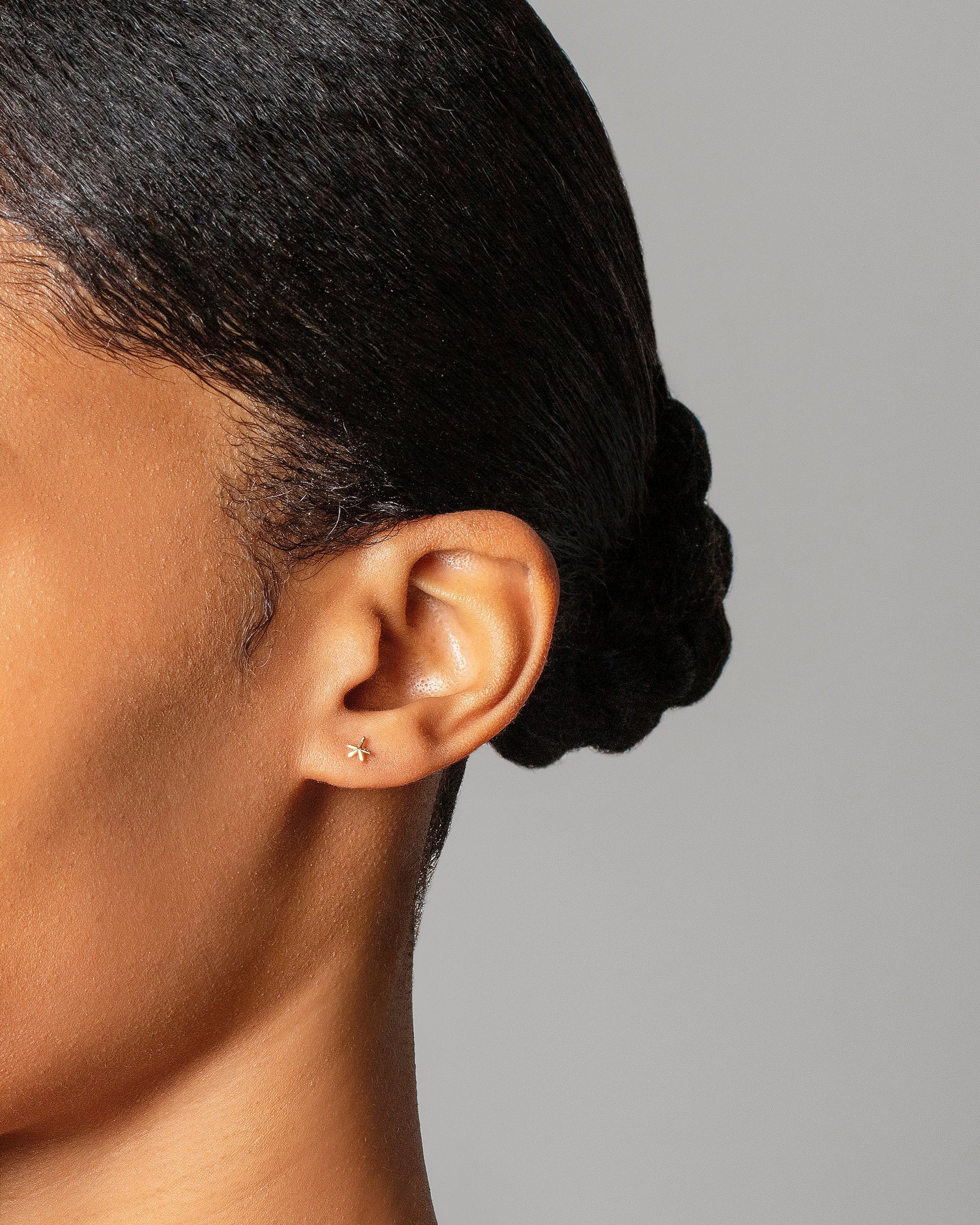 Star Stud Earring Single on model.