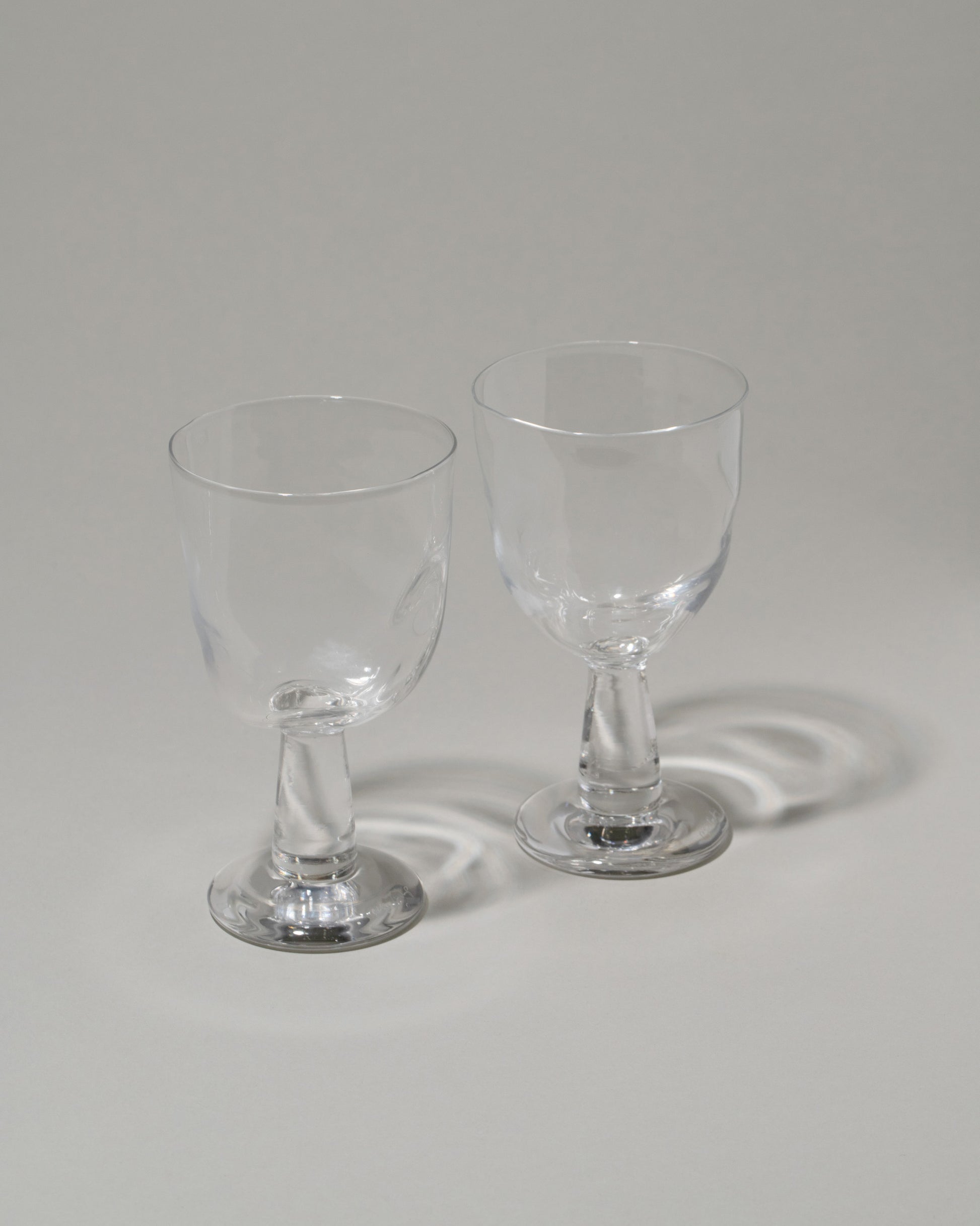 Closeup details of the Silje Lindrup Twisted Liqueur Glasses on light color background.