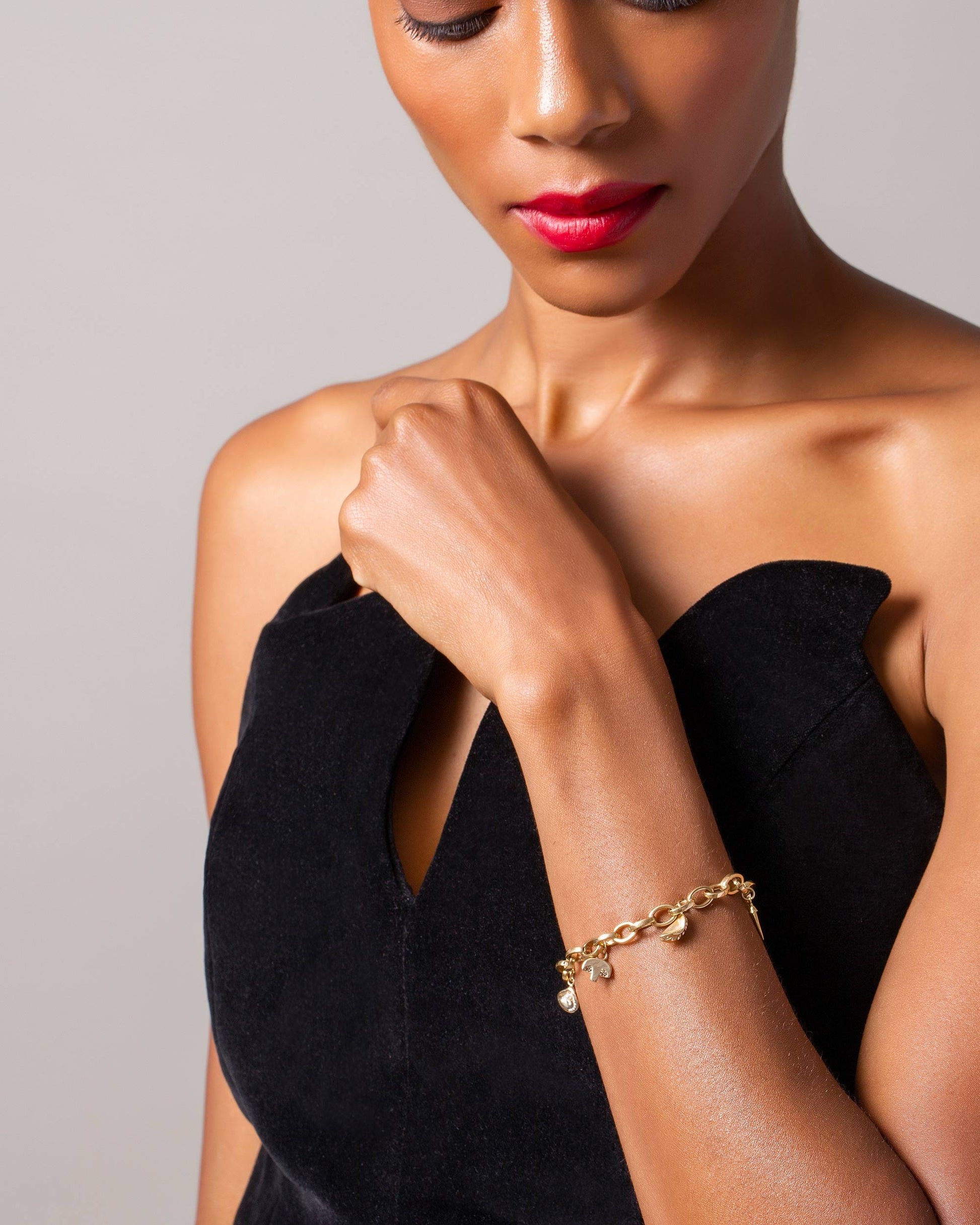 Steamed Dumpling Charm, Button Mushroom Charm, Clam on Half Shell Charm, Snap Pea Charm and Gold Endless Clasp Bracelet on model.