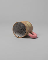 View inside of the Recreation Center Yellow Shapes & Pink Handle Shapes Mug on light color background.