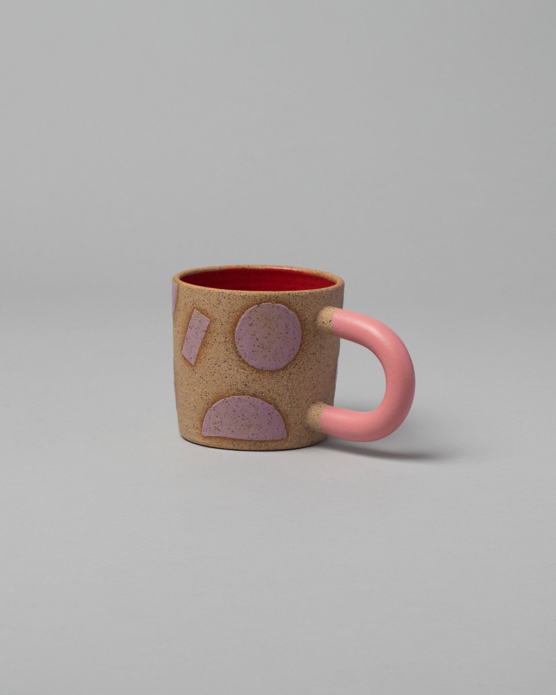 Recreation Center Pink Shapes & Pink Handle Shapes Mug on light color background.