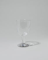 Silje Lindrup Twisted Liqueur Glass on light color background.