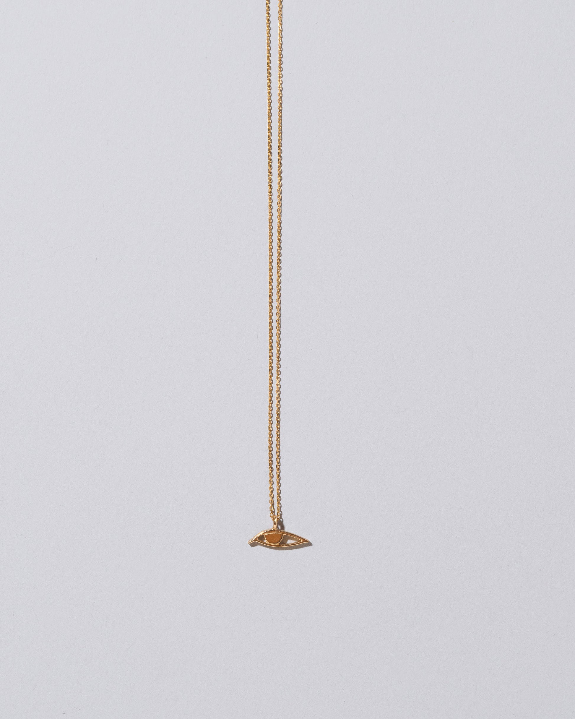 Eye Talisman Pendant Necklace on light color background.