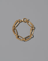 CRZM Gold Ophiolite Bracelet on light color background.