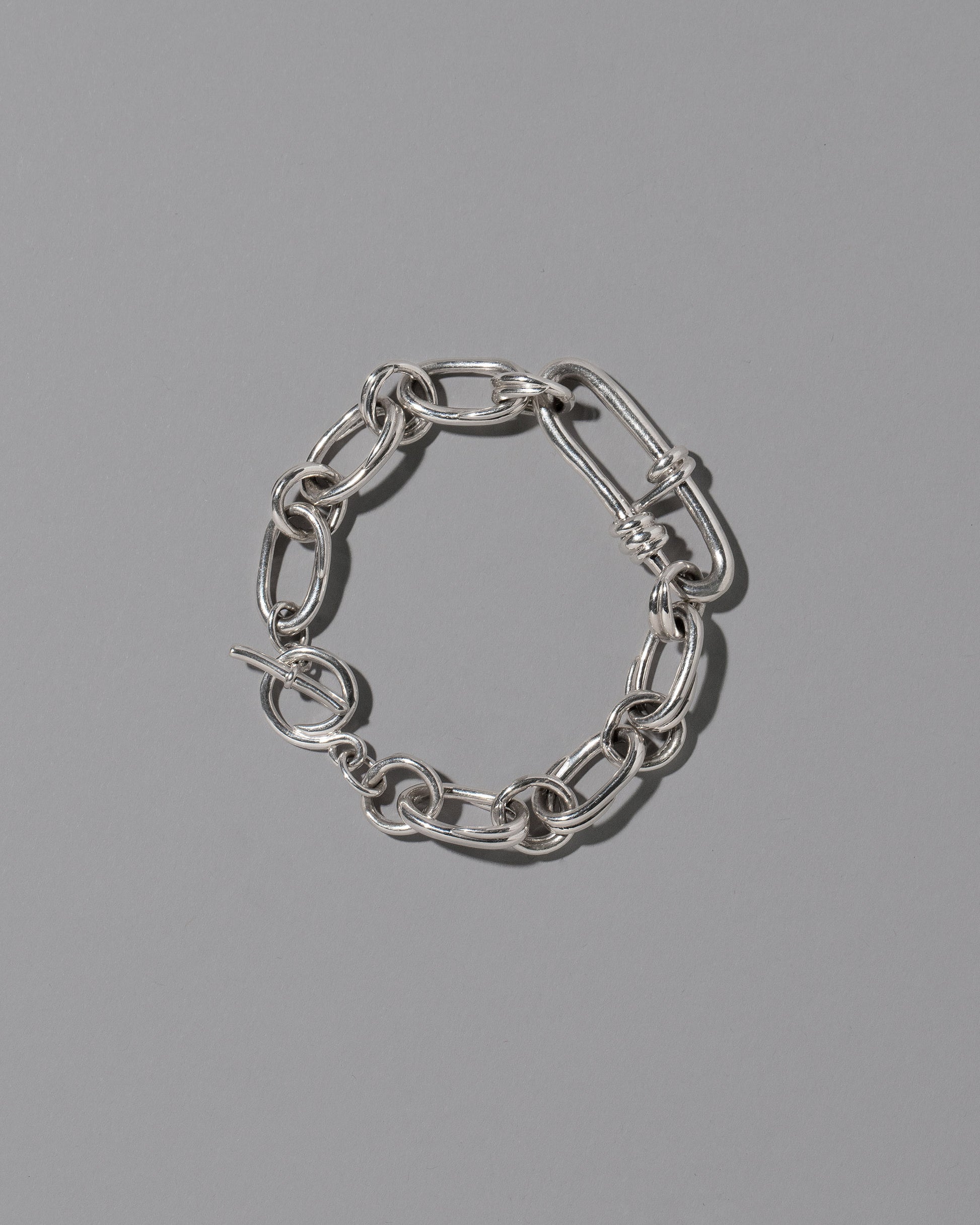 CRZM Sterling Silver Canyon Bracelet on light color background.