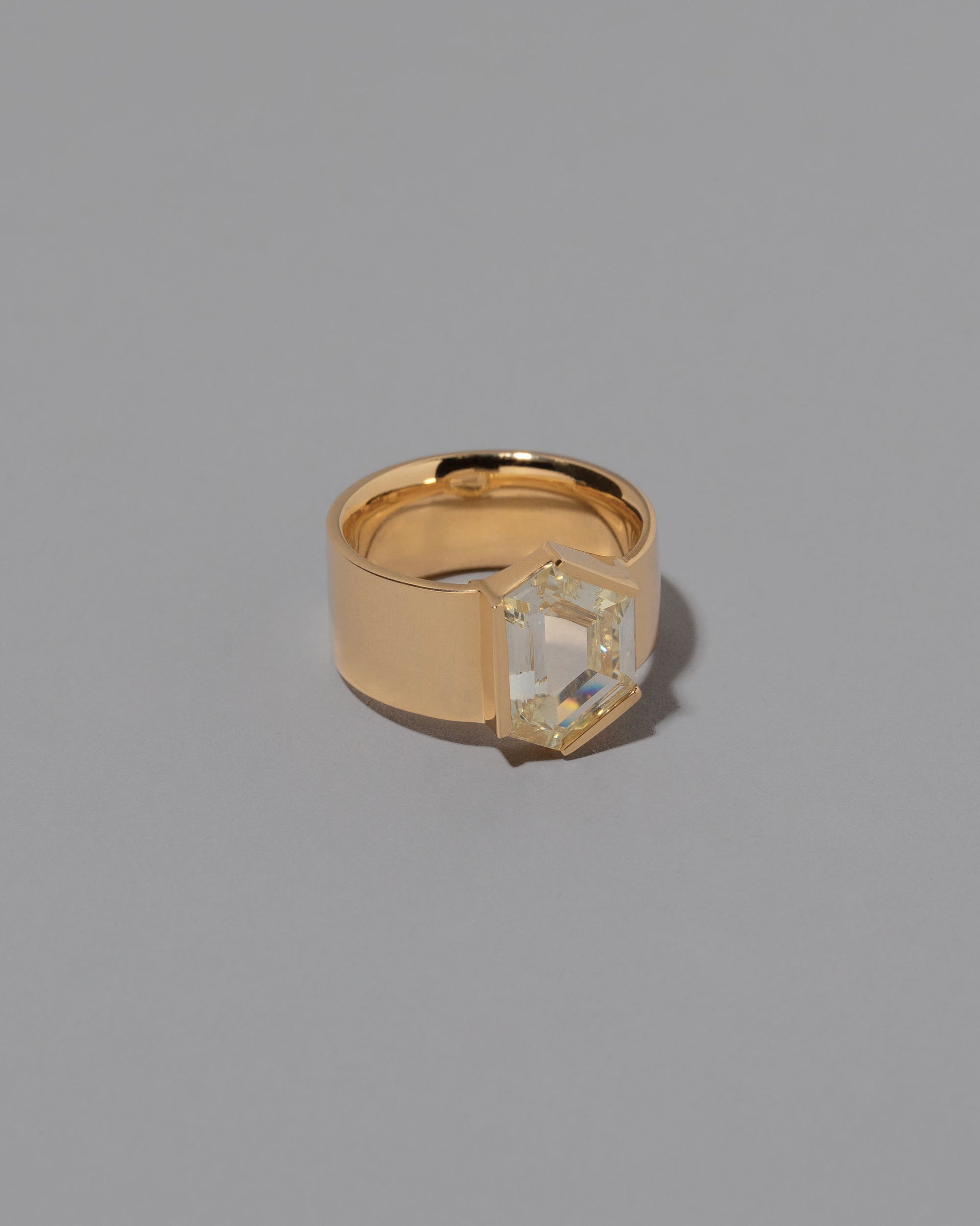 View from the side of the Wrap Ring on grey color background.