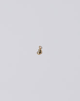 Thousand & One Night Heart Charm on light color background.