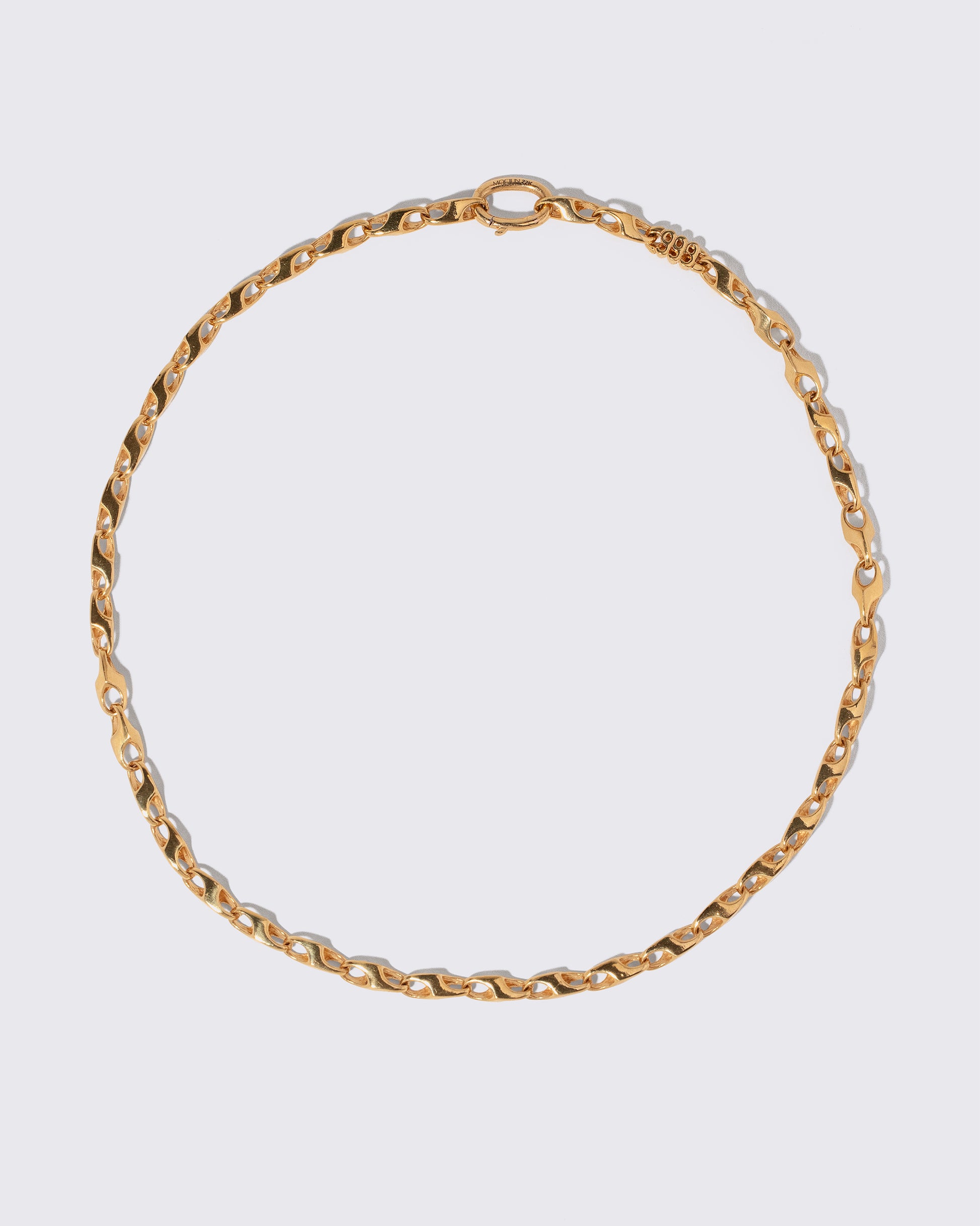 Vintage Triple Nine Chain Necklace on light color background.