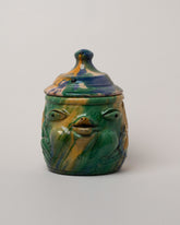 Apotropaia Head Jar on light color background.