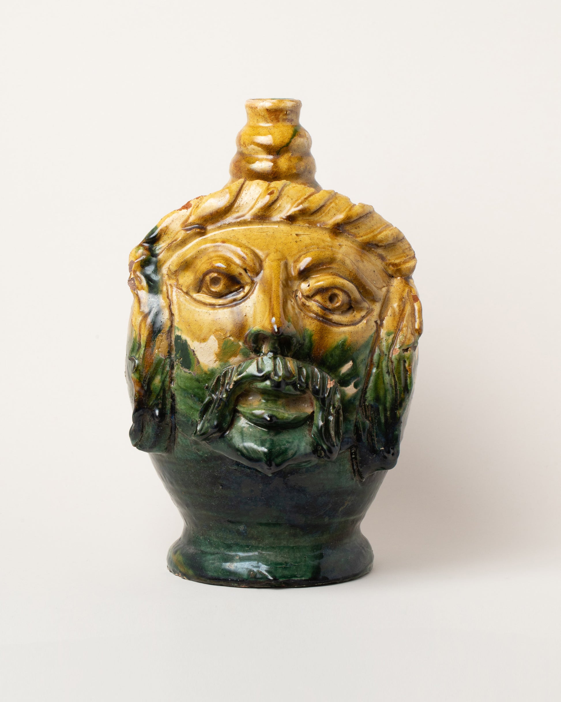 Apotropaia Large Head Jug Two on light color background.