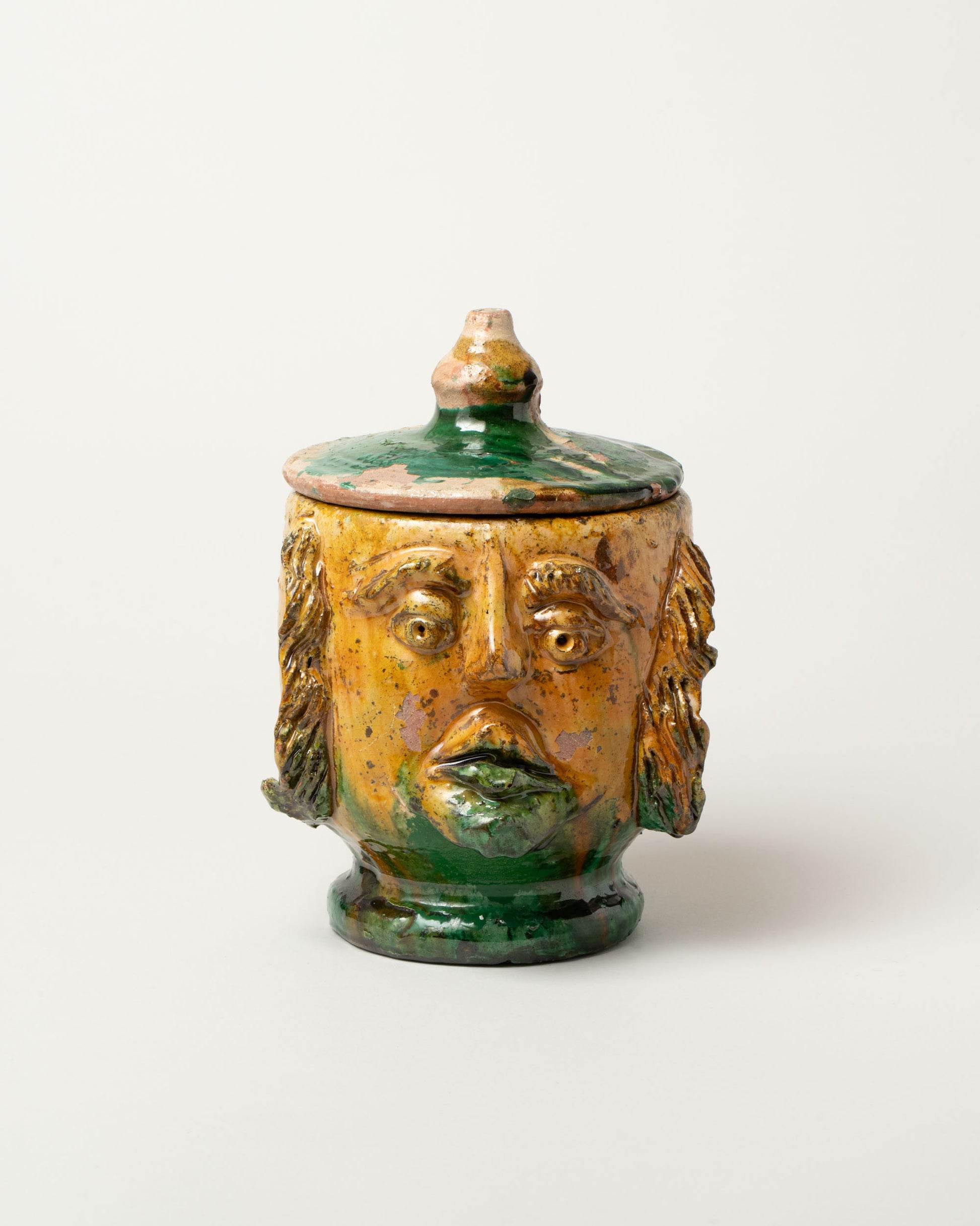 Apotropaia Lidded Head Jar One on light color background.