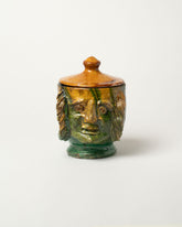 Apotropaia Lidded Head Jar Two on light color background.