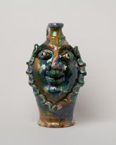 Apotropaia Medium Head Jug Two on light color background.