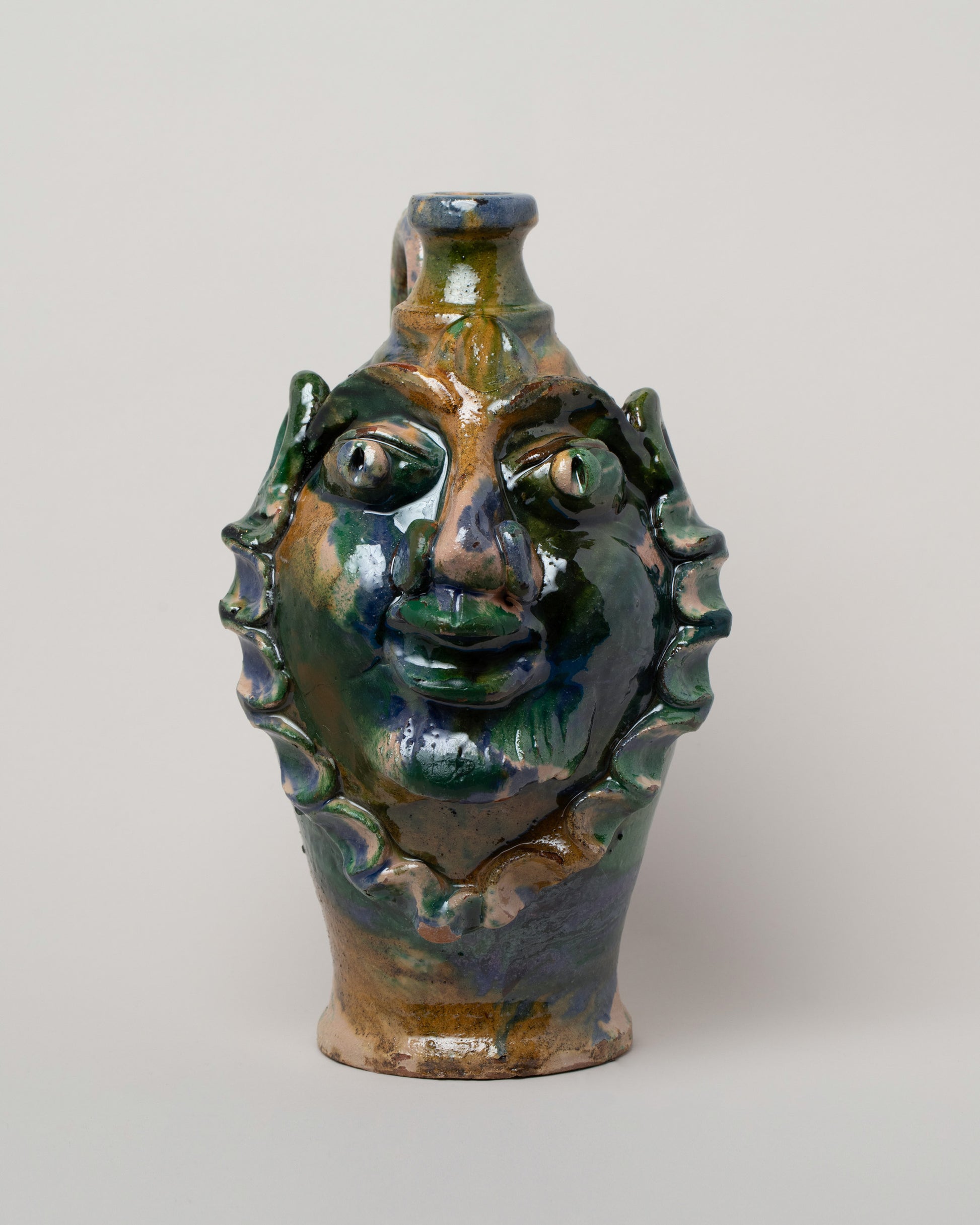 Apotropaia Medium Head Jug Two on light color background.