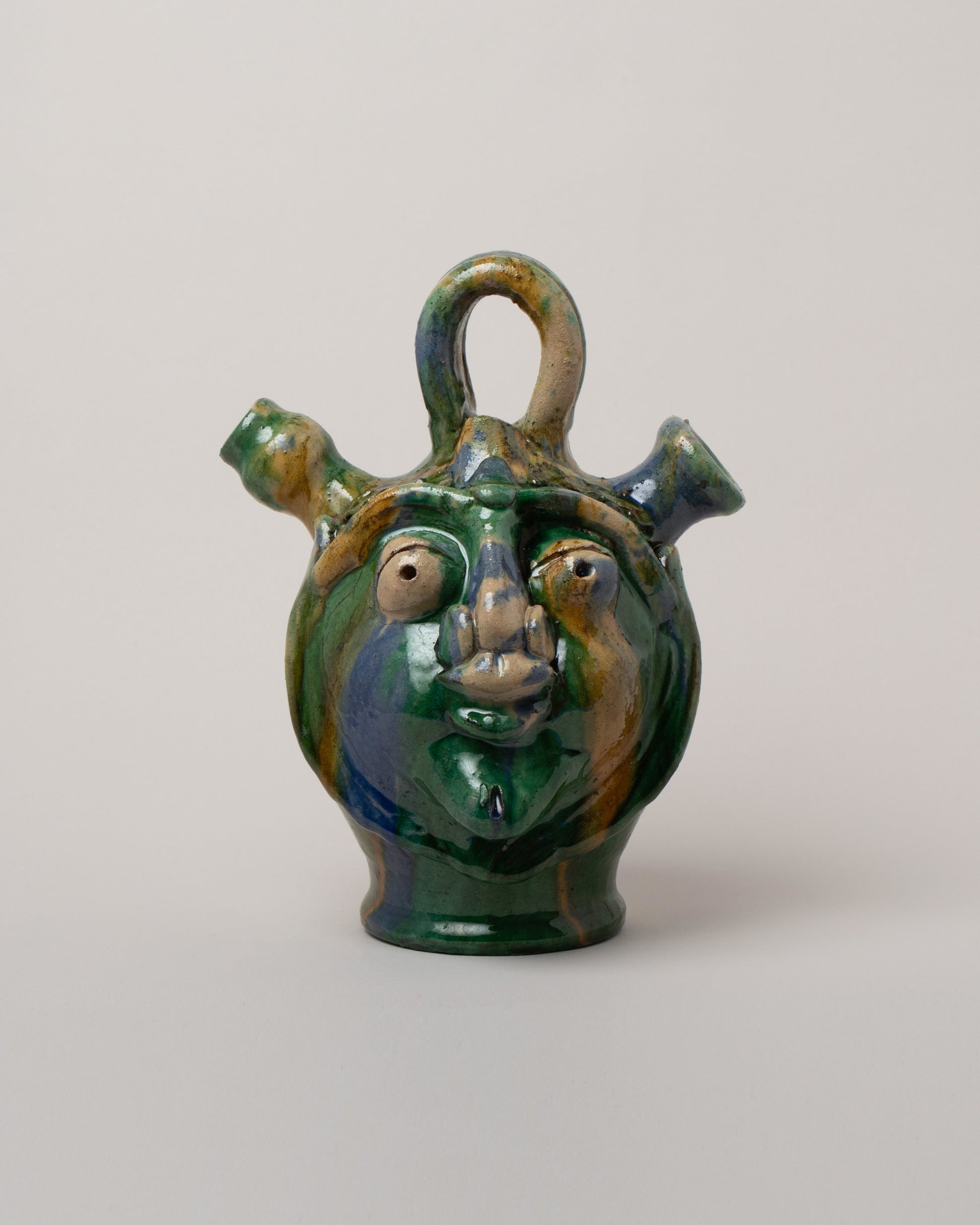 Apotropaia Small Head Flask on light color background.