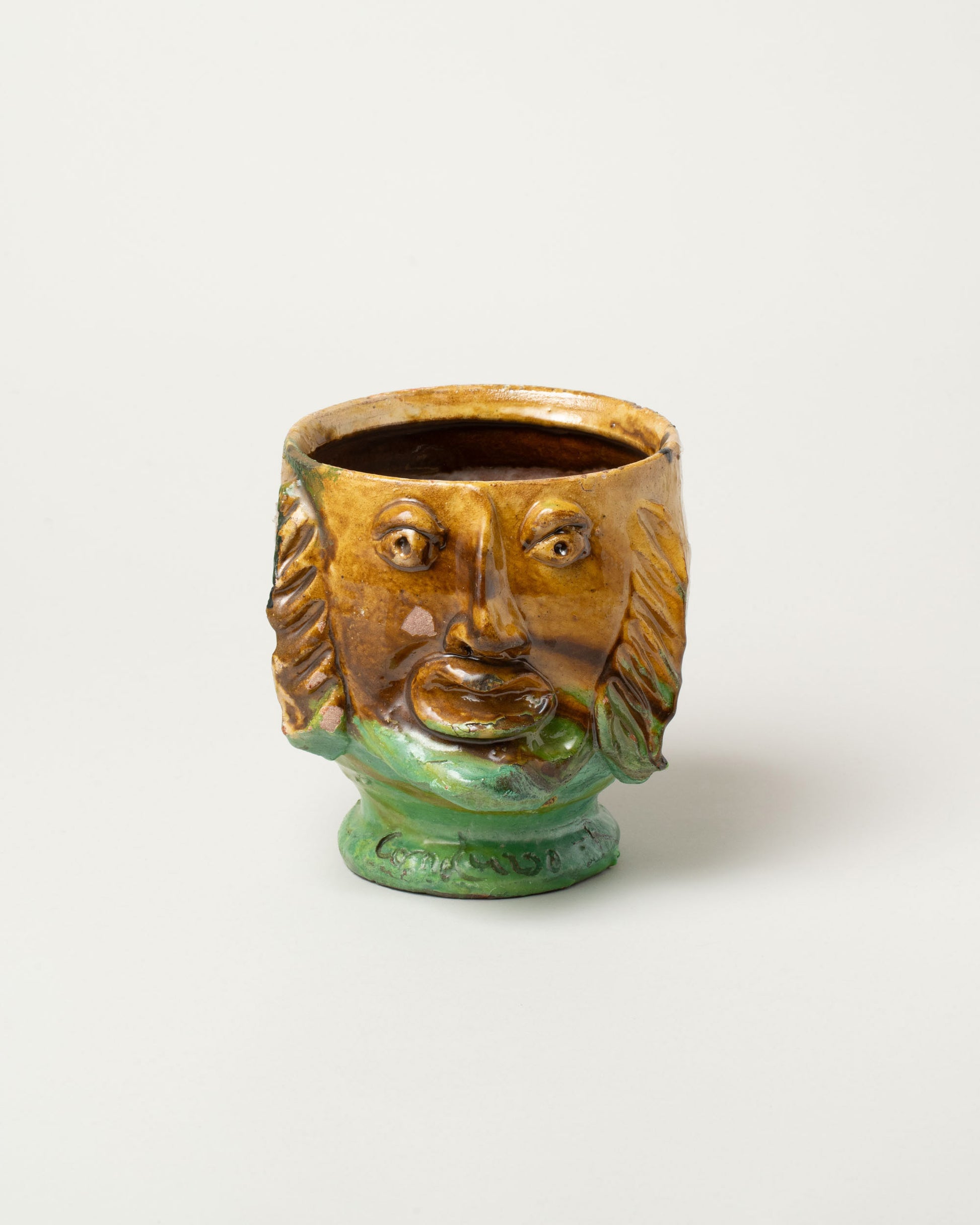 Apotropaia Small Head Pot on light color background.