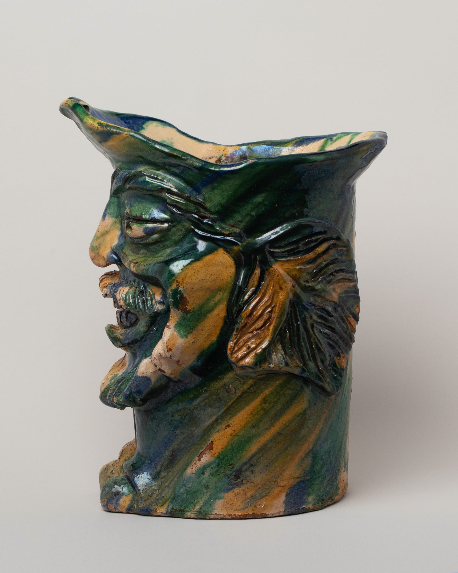 View from the side of the Apotropaia Extra Large Head Vessel on light color background.