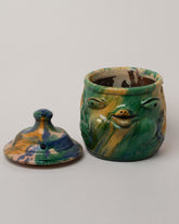 Detail view of the Apotropaia Head Jar on light color background.