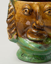 Closeup details of the Apotropaia Small Head Pot on light color background.