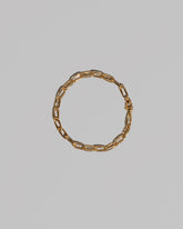 Wavy Link Chain Bracelet on light color background.