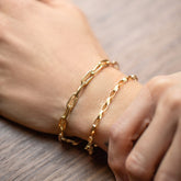 product_details::Wavy Link Chain Bracelet and Flat Oval Link Chain Bracelet on model.