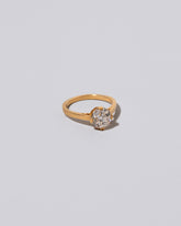 View from the side of  past version of the Super White Diamond Barragán Ring on light color background.