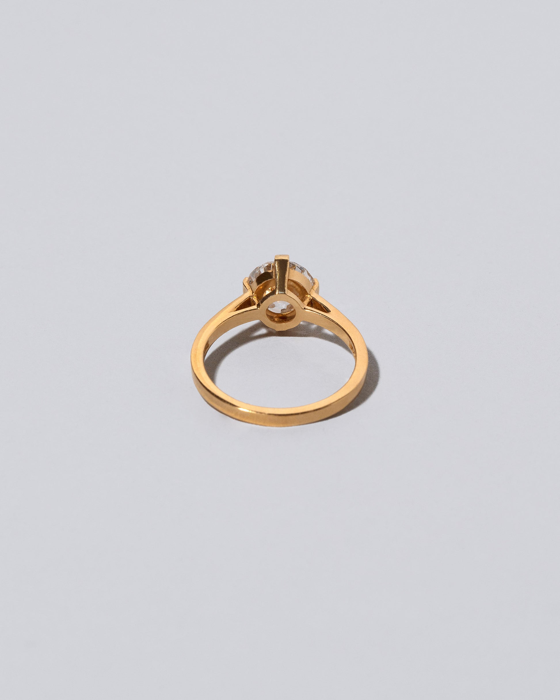 View from the back of a past version. of the Super White Diamond Barragán Ring on light color background.