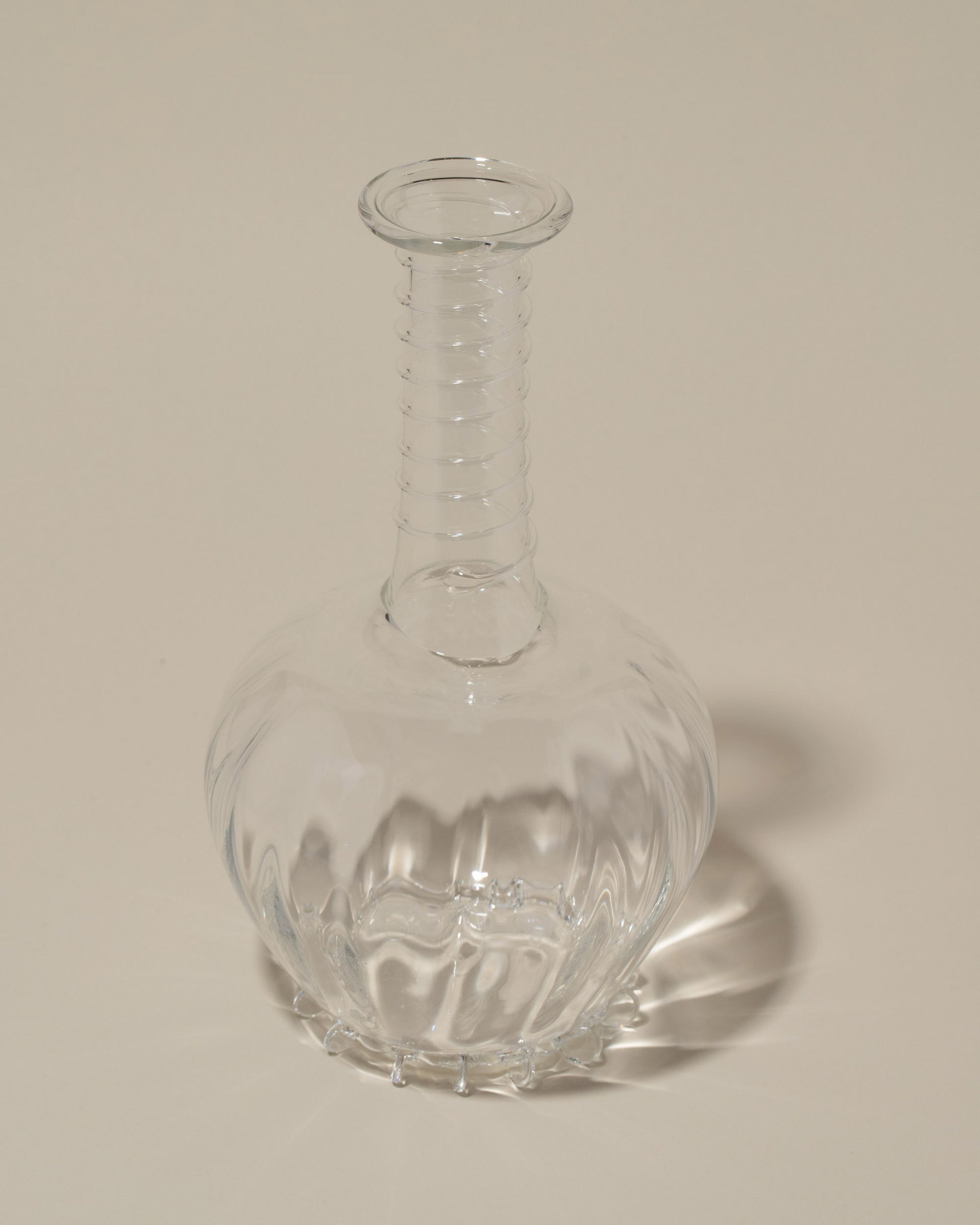 Closeup details of the Bollenglass Design Spiral Bud Vase on light color background.