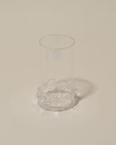 Closeup details of the Bollenglass Design Clear Dot Highball Glass on light color background.