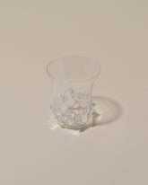 Closeup details of the Bollenglass Design Clear Liquor Glass on light color background.