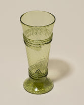 Closeup details of the Bollenglass Design Green Small Spiral Tumbler on light color background.