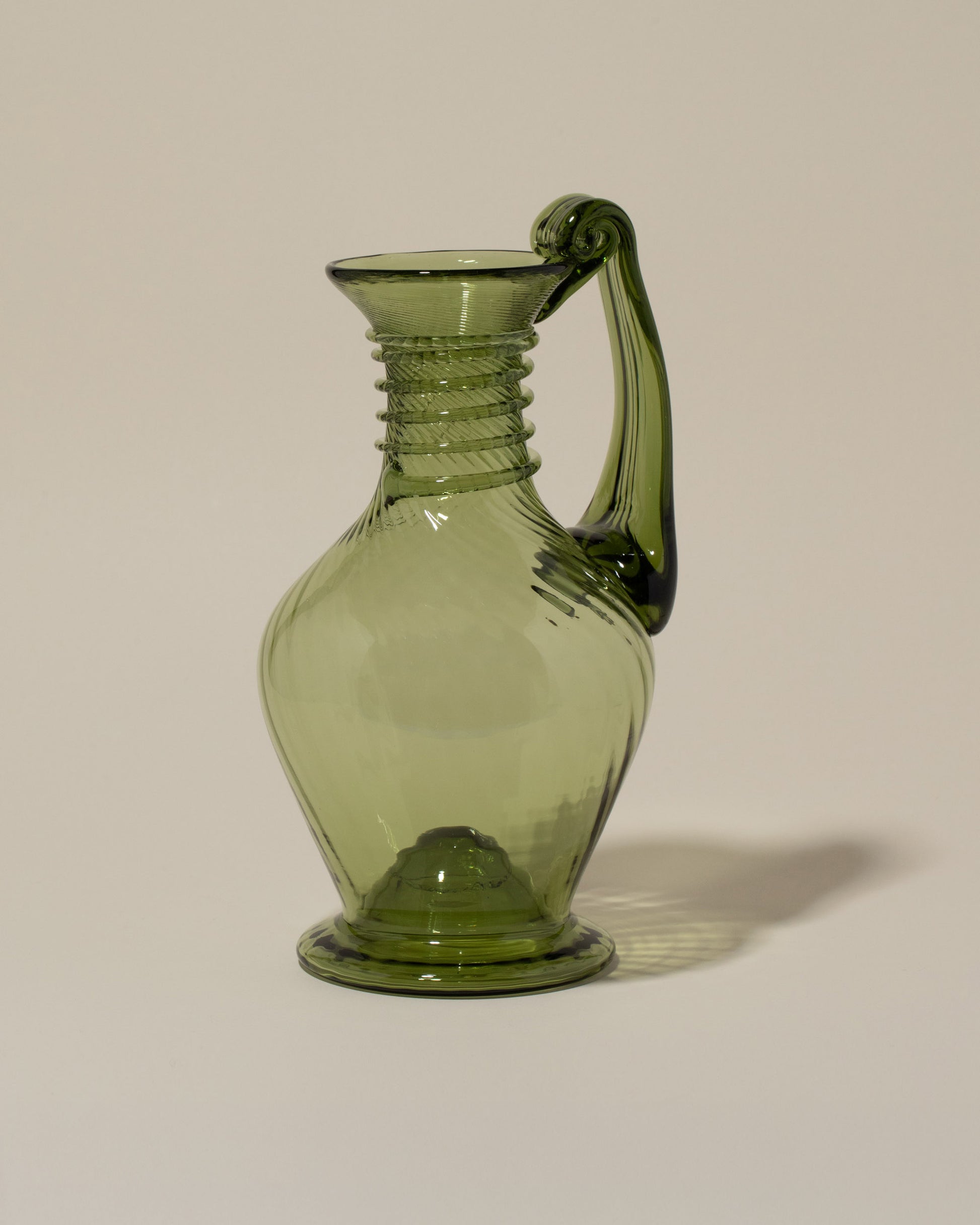 Bollenglass Design Green Spiral Jug on light color background.