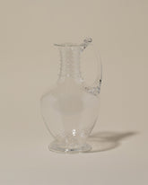 Bollenglass Design Clear Spiral Jug on light color background.