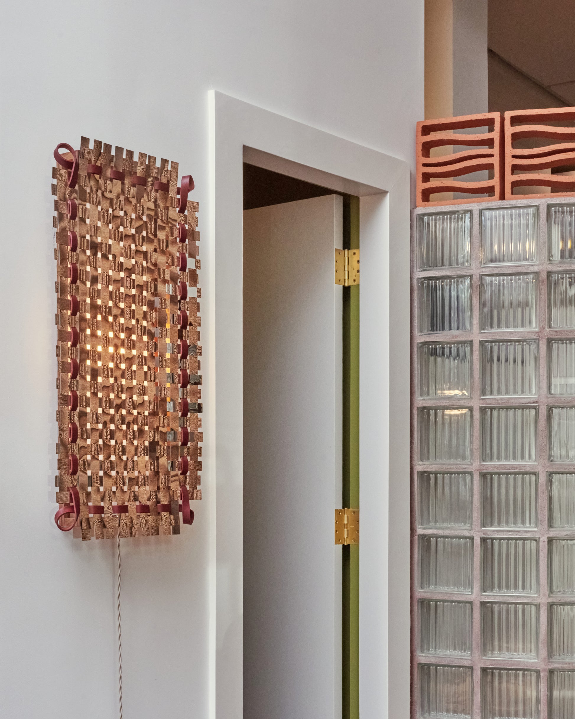 Styled image white lit of the Bower Studios Woven Mirror II.