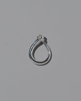 View from the side of the CRZM Sterling Silver Boulder Ring on light color background.