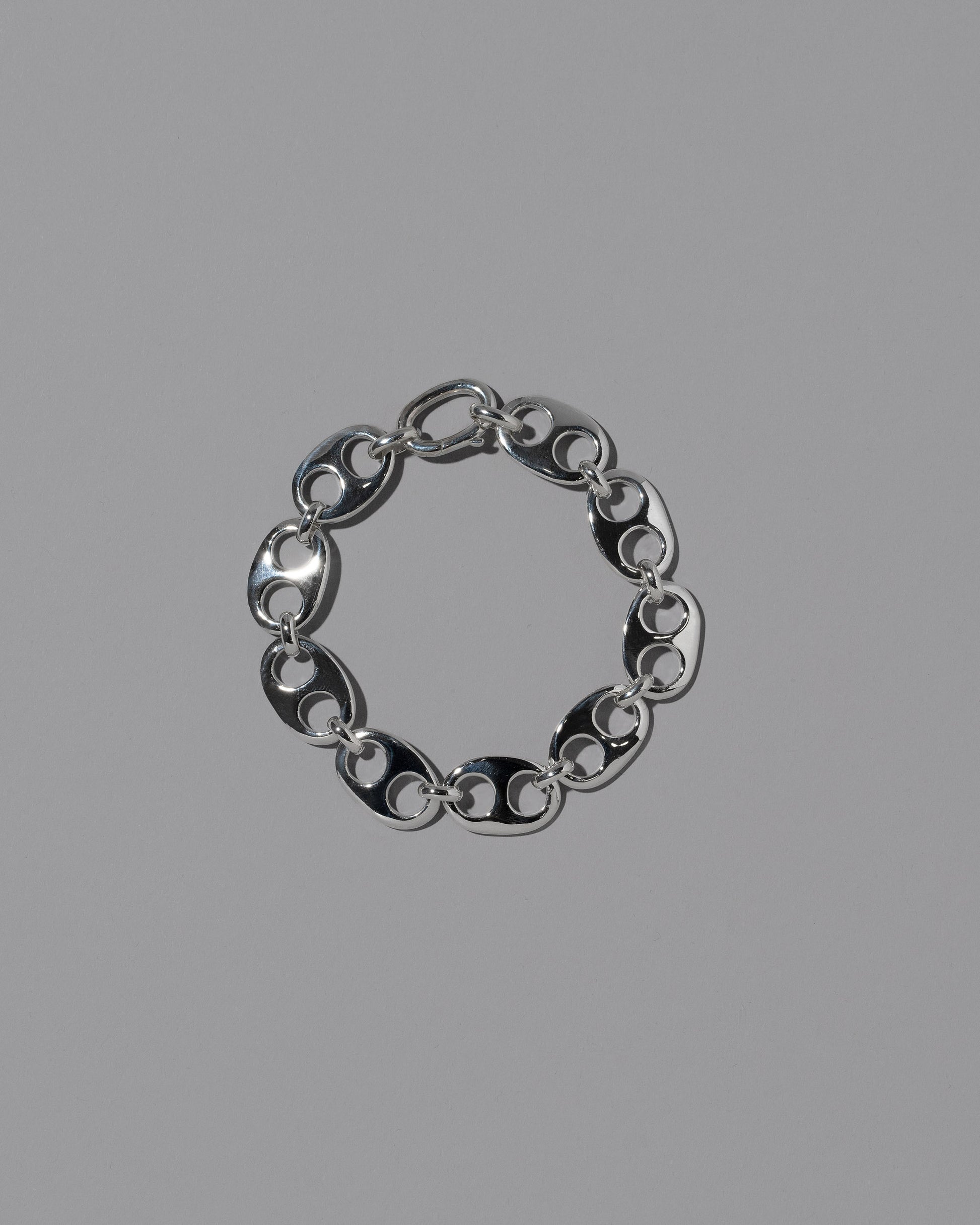 CRZM Sterling Silver Yuba Medium Bracelet on light color background.