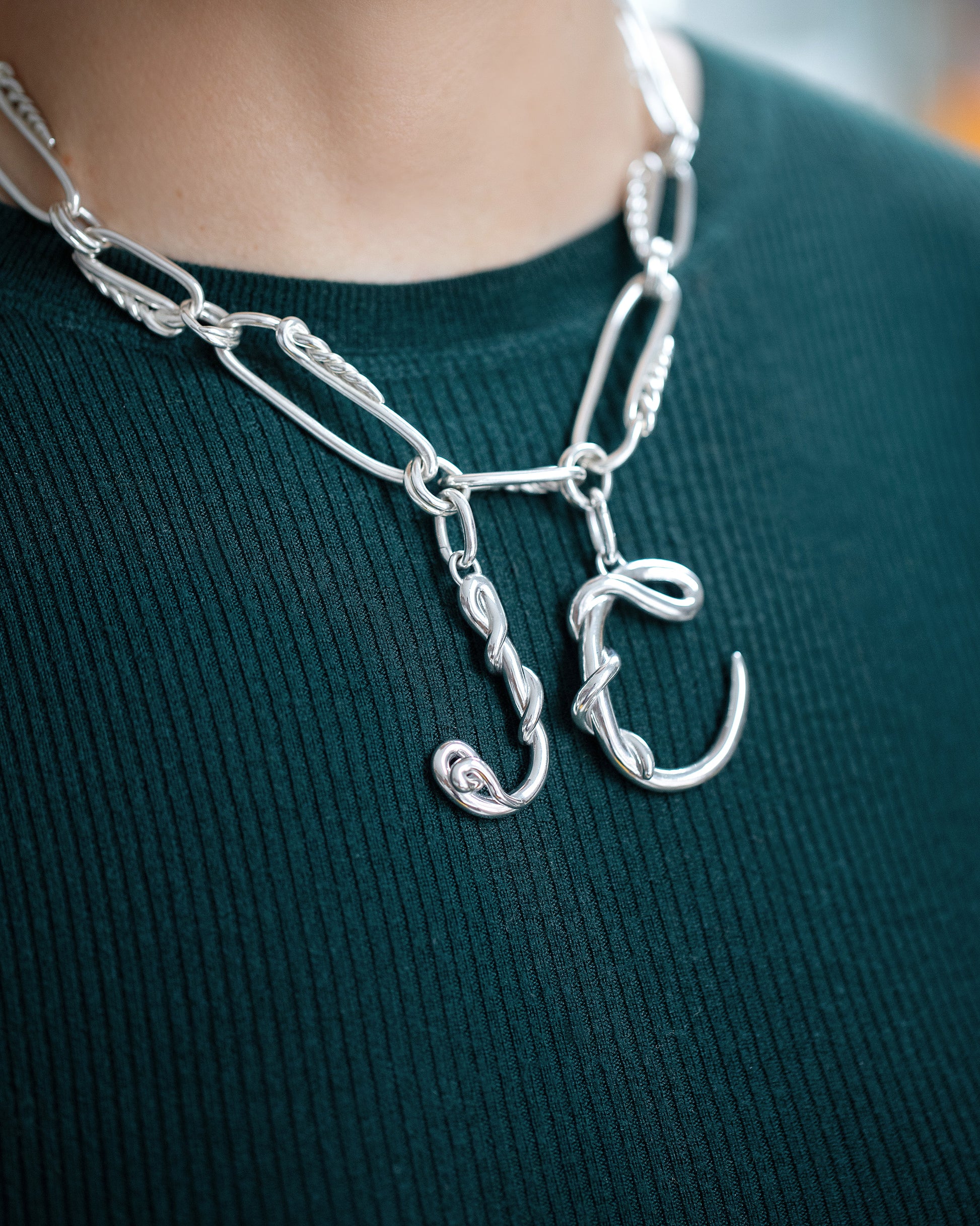CRZM Sterling Silver Canyon Necklace and CRZM Letter J and Letter C Large Sterling Silver Letter Charms on model.