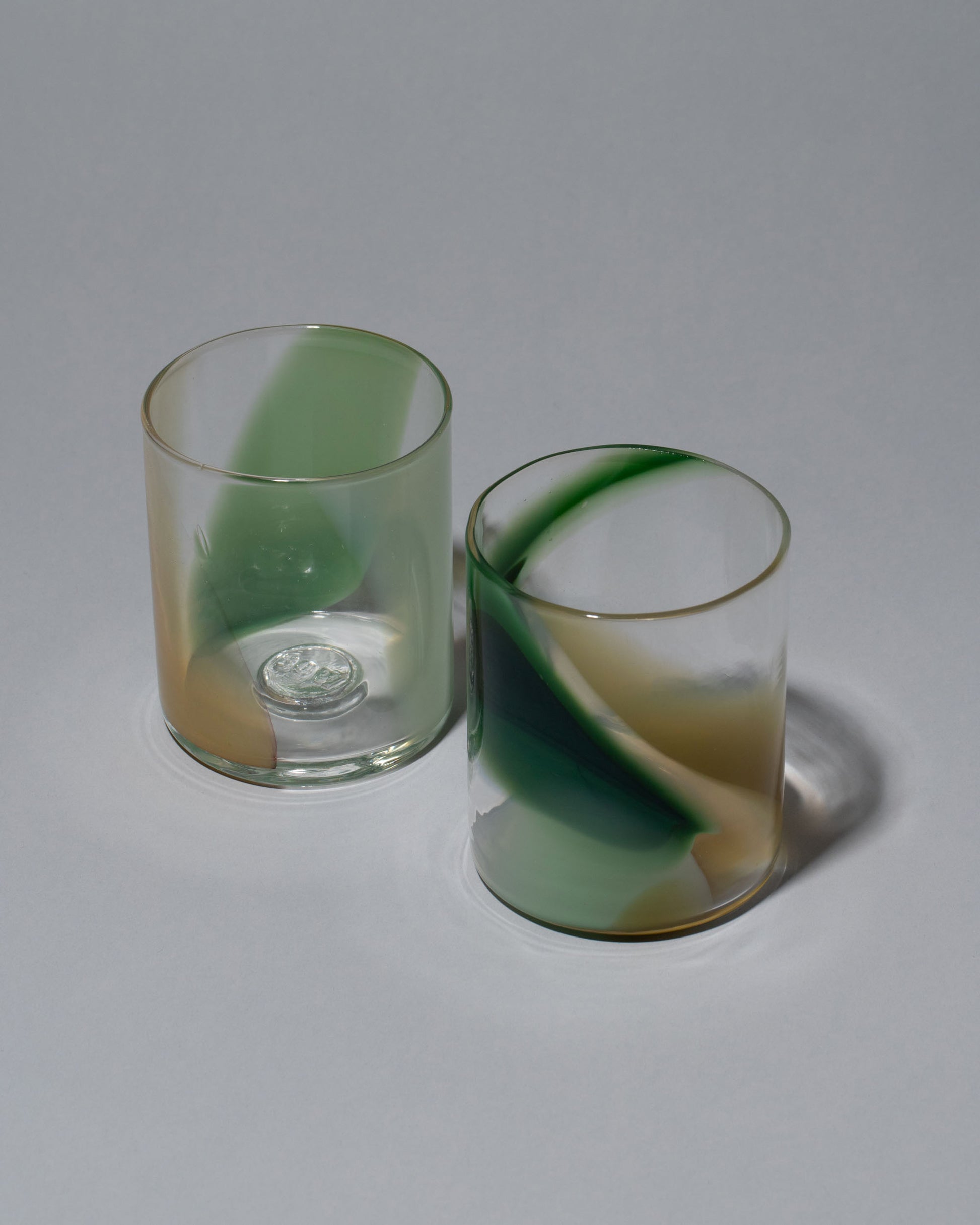 Group photo of Bow Glassworks Seaside Splash Cups on light color background.