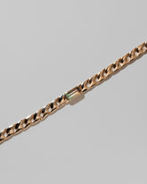 Closeup details of the Identity Chain Bicolor Tourmaline Bracelet 003 on light color background.