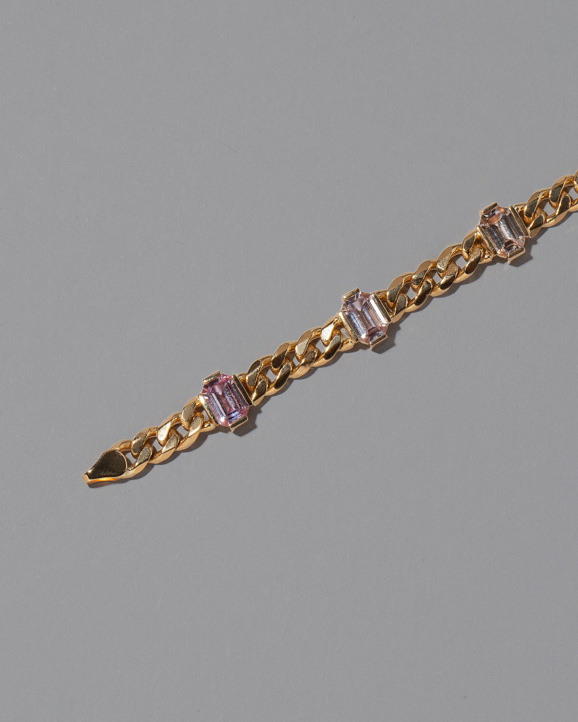 Detail view of the Envelop Bracelet on grey color background.