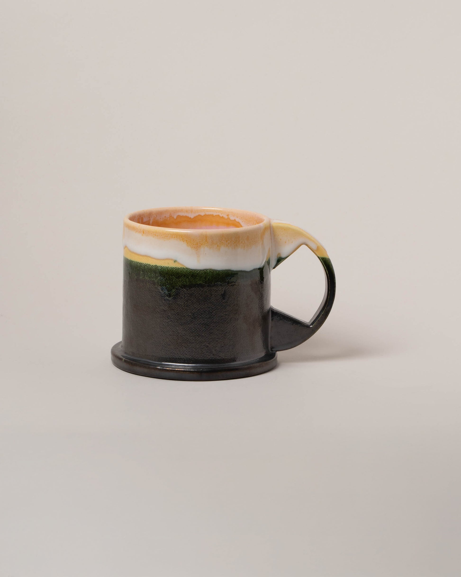Echo Park Pottery by Peter Shire Yellow and Forest & Black XL Double Dip Mug on light color background.