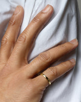 Gold 2.5mm Etched Lines Band on male model.