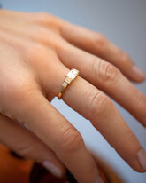 A past edition of the Gold Diamond Expression Ring on model.