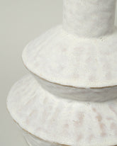 Closeup details of the Giselle Hicks Warm White Zig Zag Bottle on light color background.