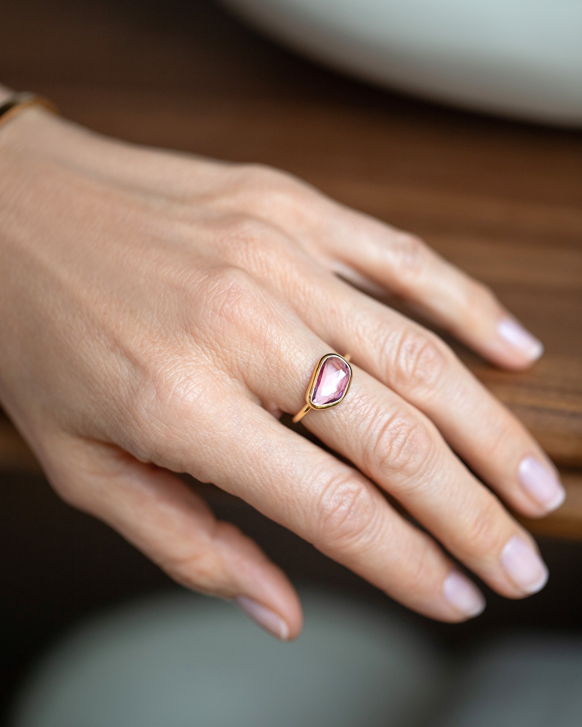 Gusher Pink Sapphire Ring 011 on model.