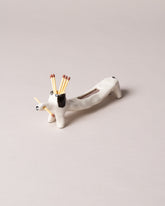 Eleonor Boström Black Matchstick Dog on light color background.