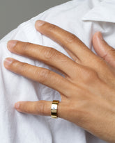 Gold Yogo Mine Cornflower Blue Sapphire 5mm Square Cut Piet Band on male model.