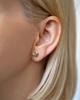 Shape Three Small Thousand & One Night Heart Stud Earrings on model.